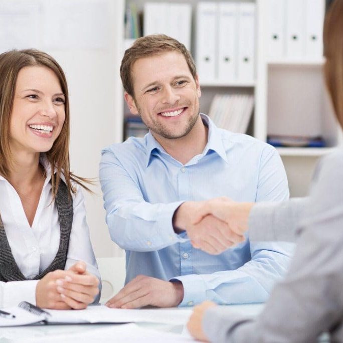 Smiling-young-man-shaking-hand